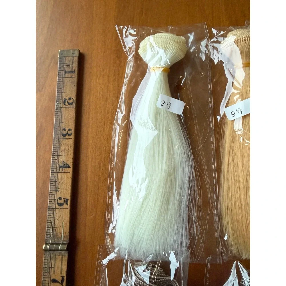 Doll hair wefts. Lot of 13